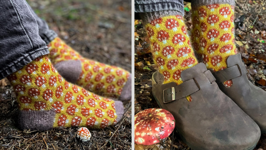 Magical Mycelium. All-over colourwork featuring red mushrooms with white spots on a yellow background with fawn contrast cuffs, heel and toe.