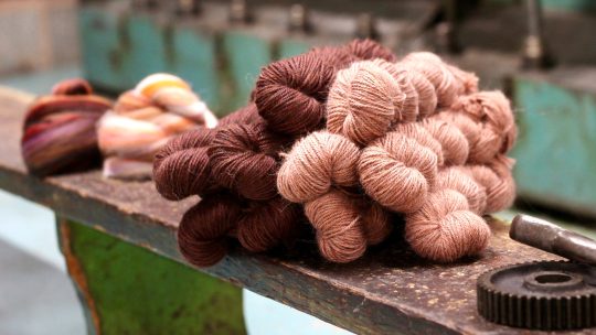 A stack of Squish specials: one a warm burgundy-ish brown, the other an orange-leaning pink.